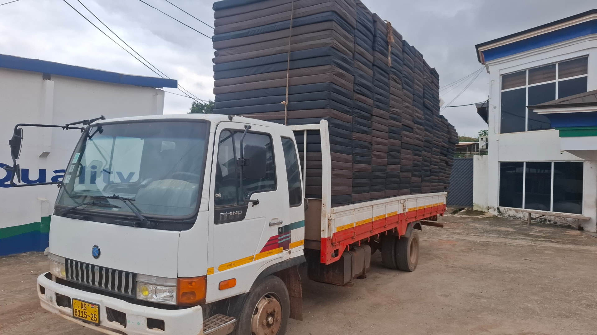 Delivery truck loaded with foam mattresses