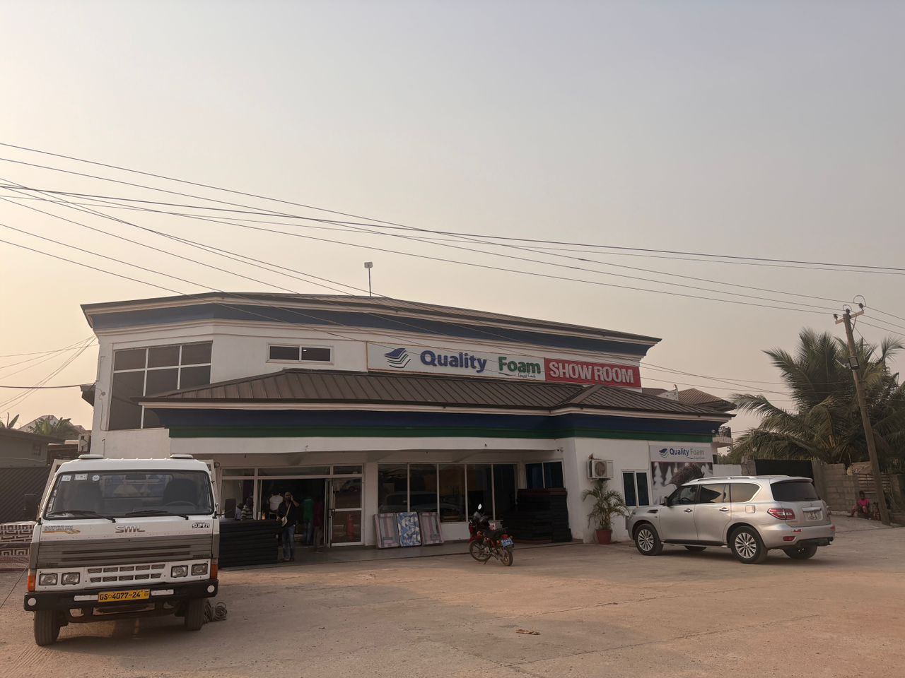 Quality Foam showroom building at dusk