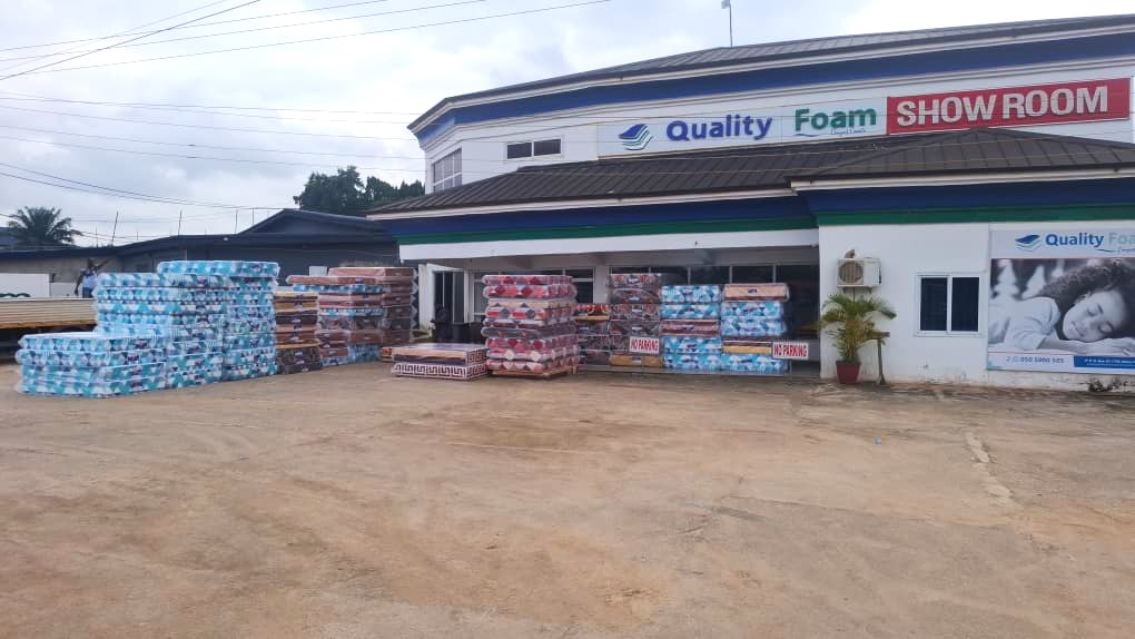 Quality Foam showroom with mattresses stacked outside